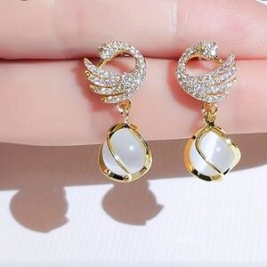 Elegant Gold and Silver Swan Earrings
